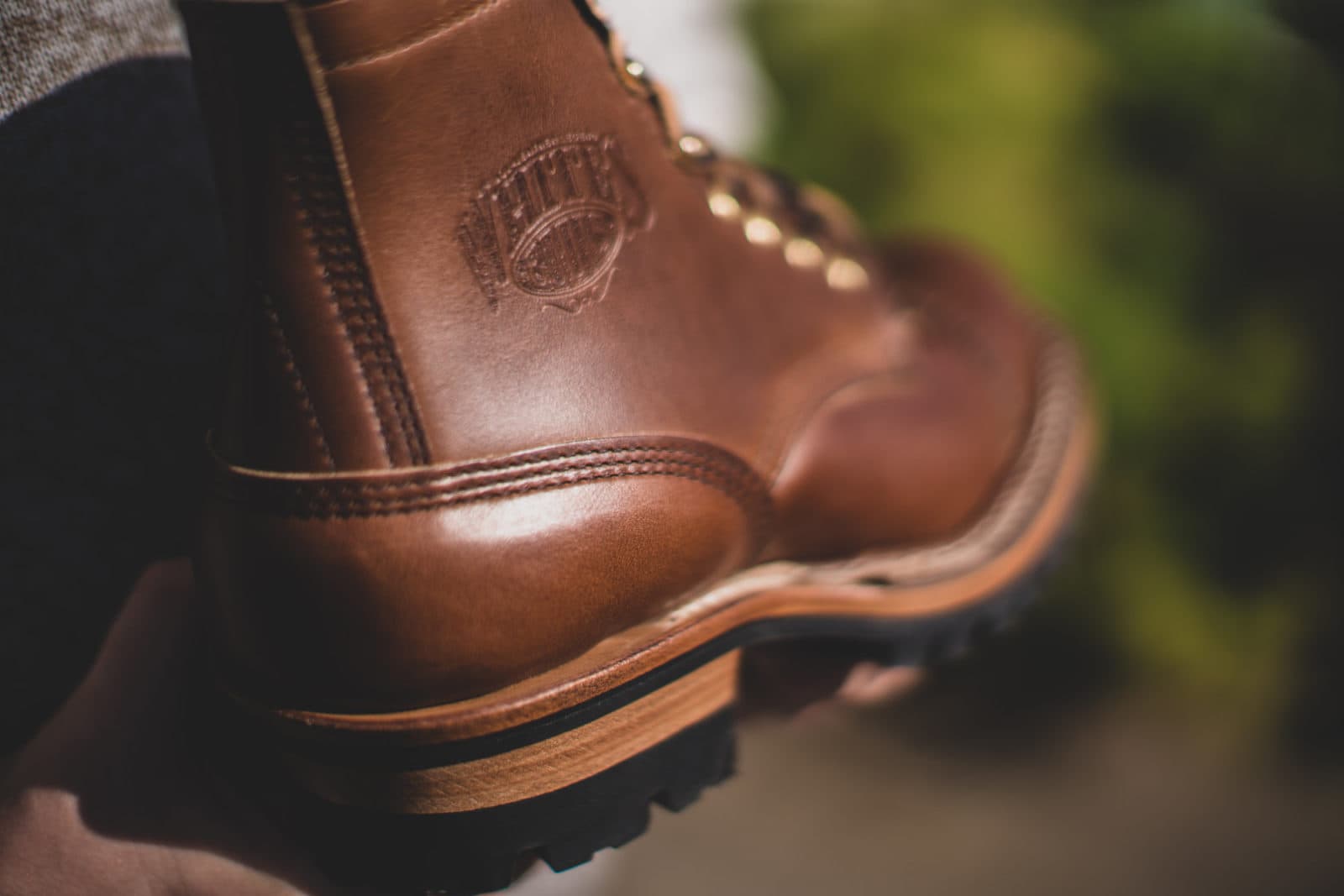 Close-up of brown boot with heel stamp