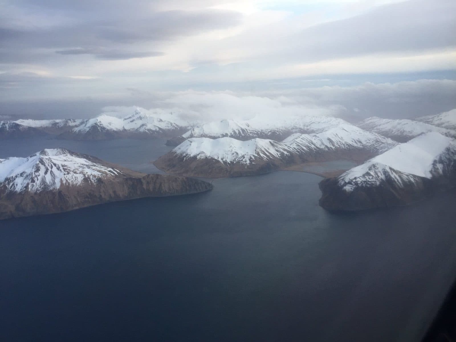 Aerial snow-capped islands and fjord
