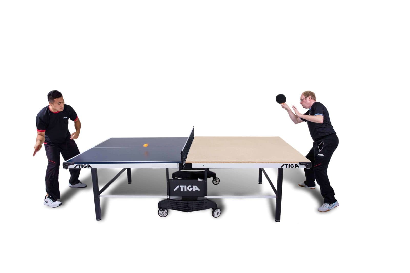 Two men playing ping pong on white