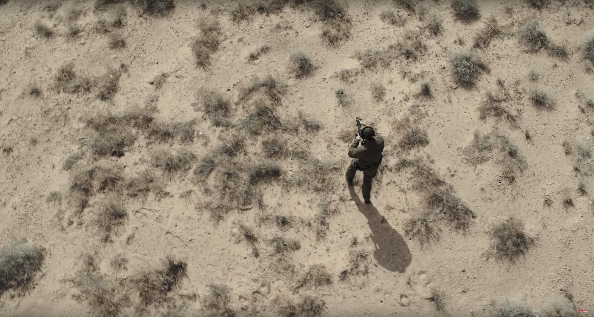 Aerial of SWAT operator in desert scrub
