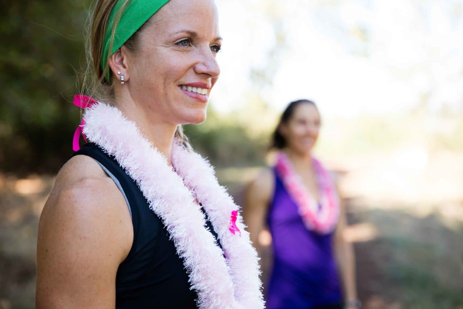 Smiling runner wearing pink lei