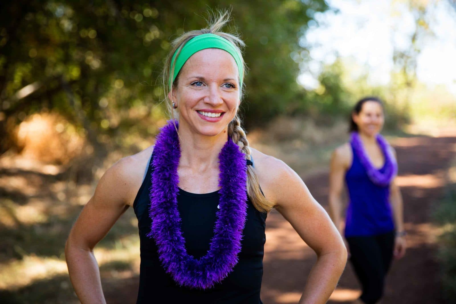 Runner in purple lei on trail