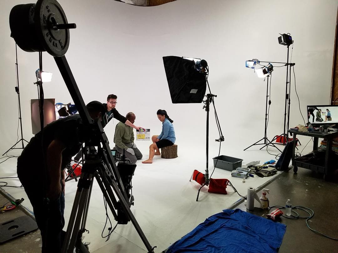 Behind the scenes of a shoot on the white cyclorama