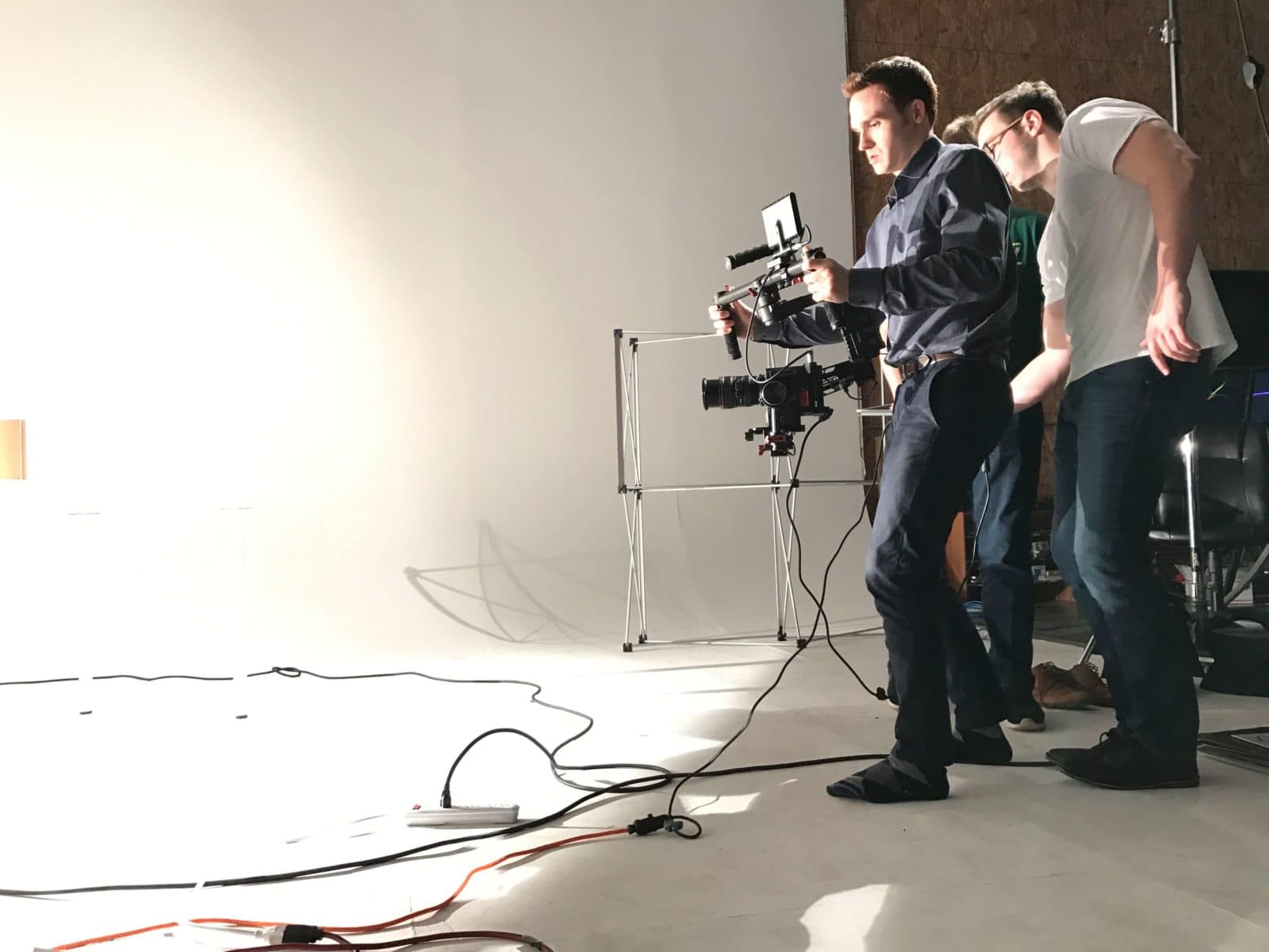 An FPW crew operating a gimbal rig in the white studio