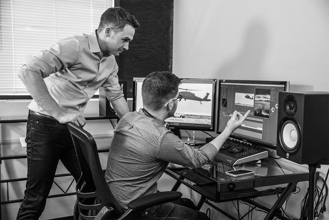 Two FPW editors working side by side at a studio workstation