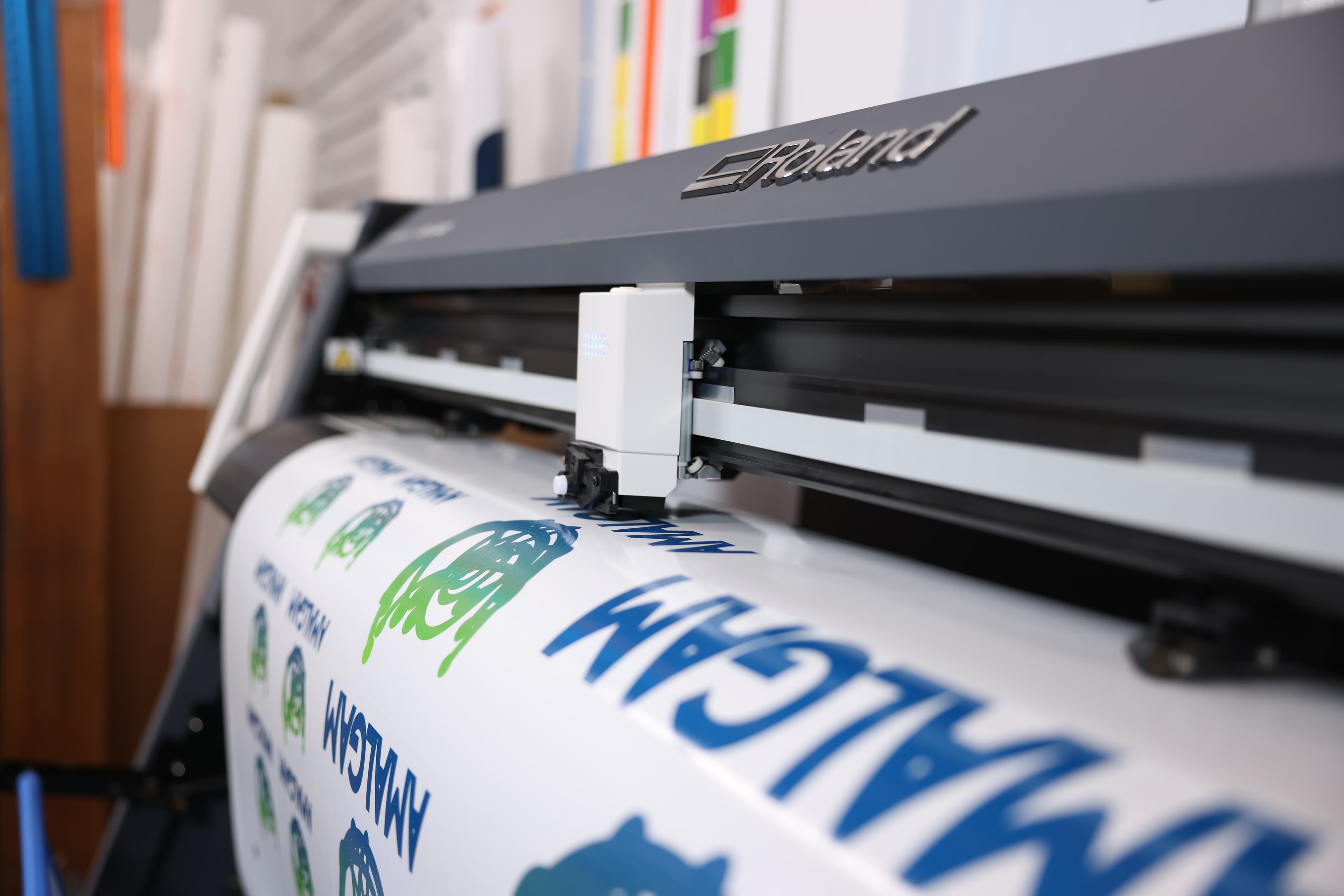 FPW’s wide-format printer printing a banner