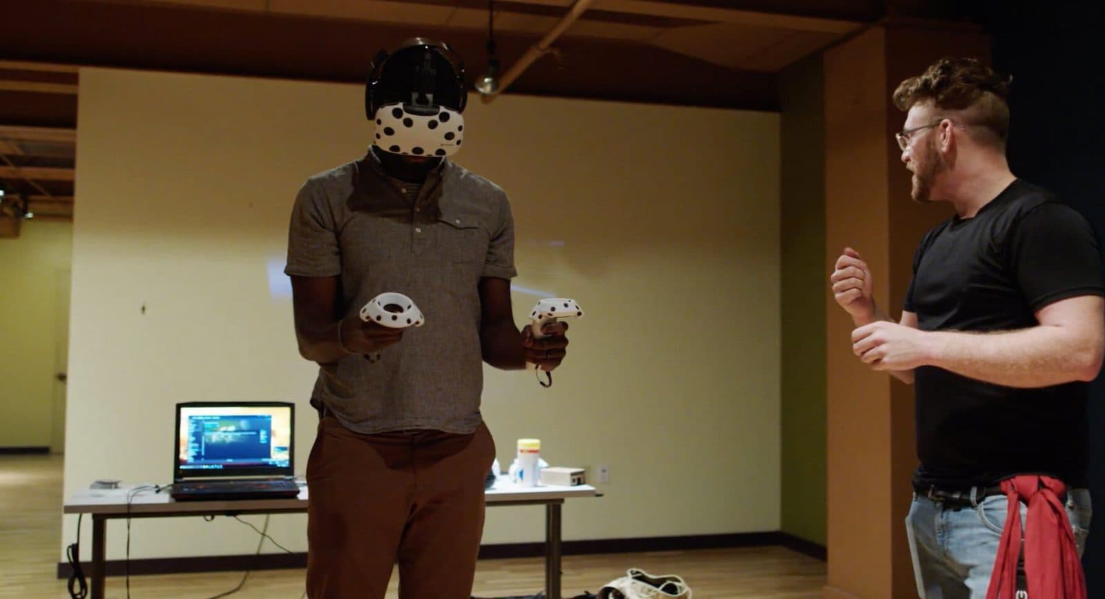 A visitor trying a VR headset during a tech tour
