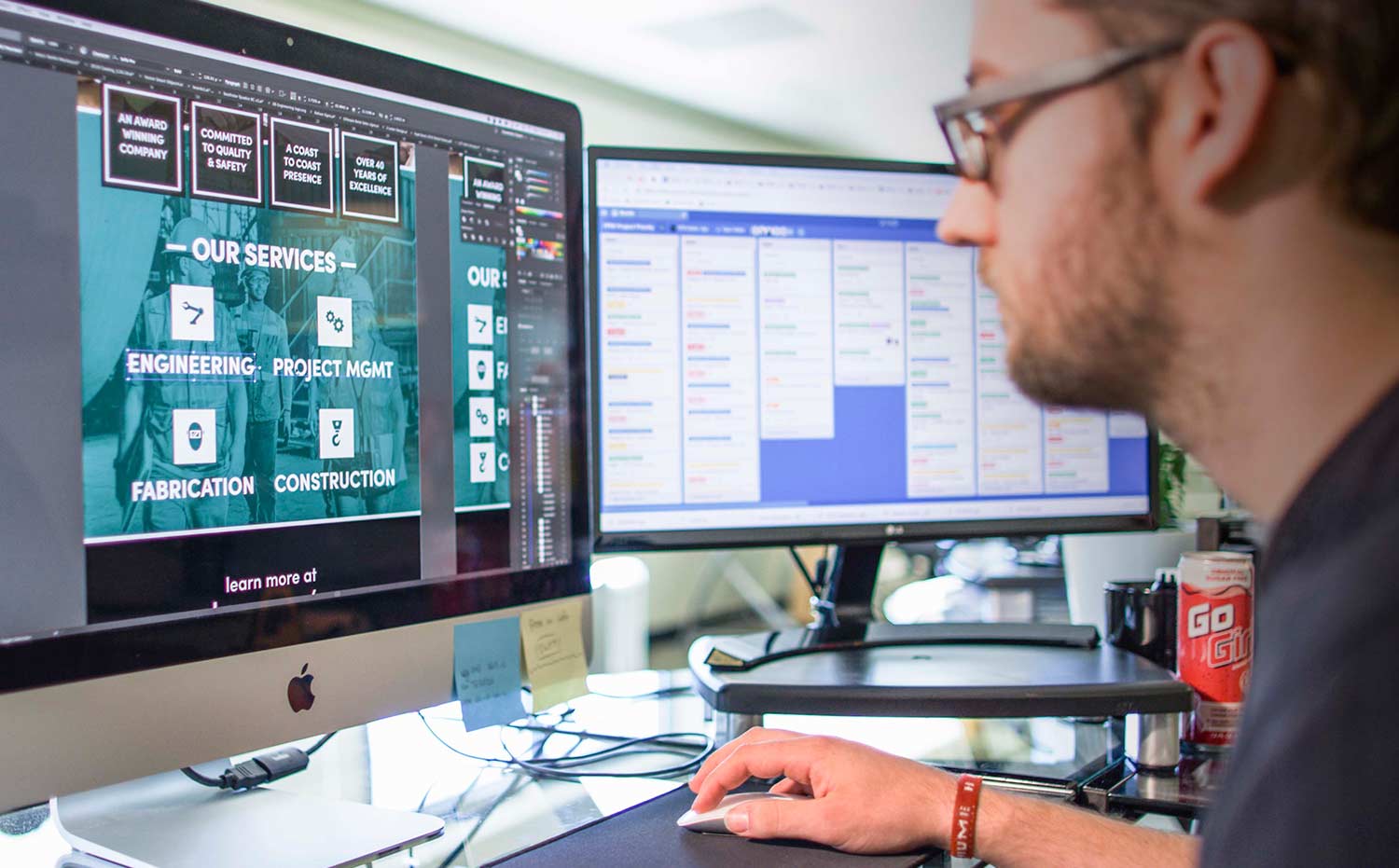 An FPW designer working at a dual-monitor desk